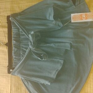 Stylish Greenish Blue Skirtwith Unique Fun Tie In Front. Pleated lol In the back